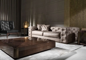 furniture: "TURNER SOFA" SOFA WITH STRUCTURE IN POPLAR WOOD AND FOAM. UPHOLSTERY IN FABRIC OR LEATHER FROM THE COLLECTION WITH ARMS AND BACK IN CAPITONNé WITH METAL PLATES AVAILABLE IN ALL THE FINISHINGS FROM THE COLLECTION. BASE IN METAL AVAILABLE IN BRUSHED FINISH | ARCHONTIKIS - ROBERTO CAVALLI